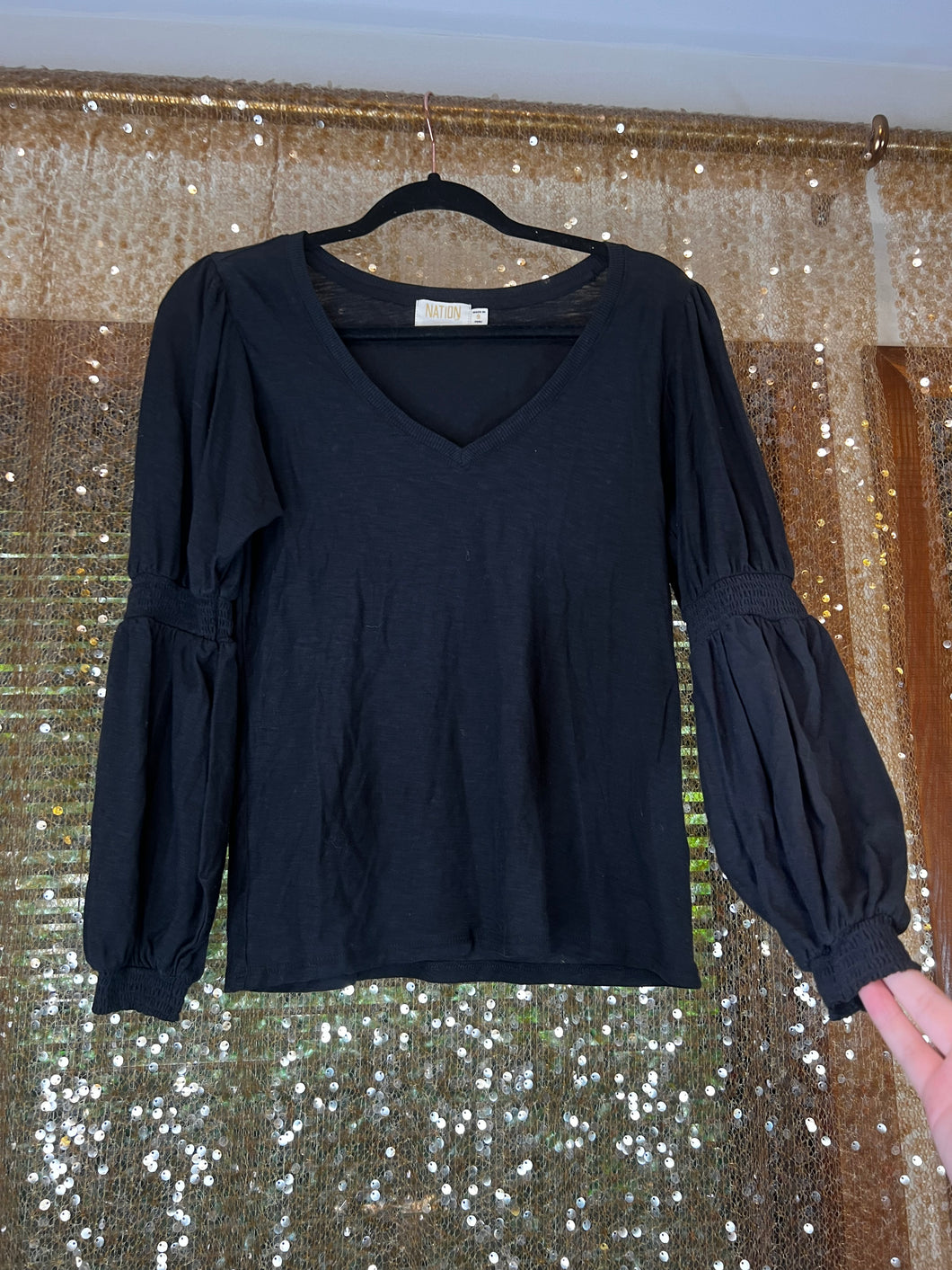 Bell style sleeved black top